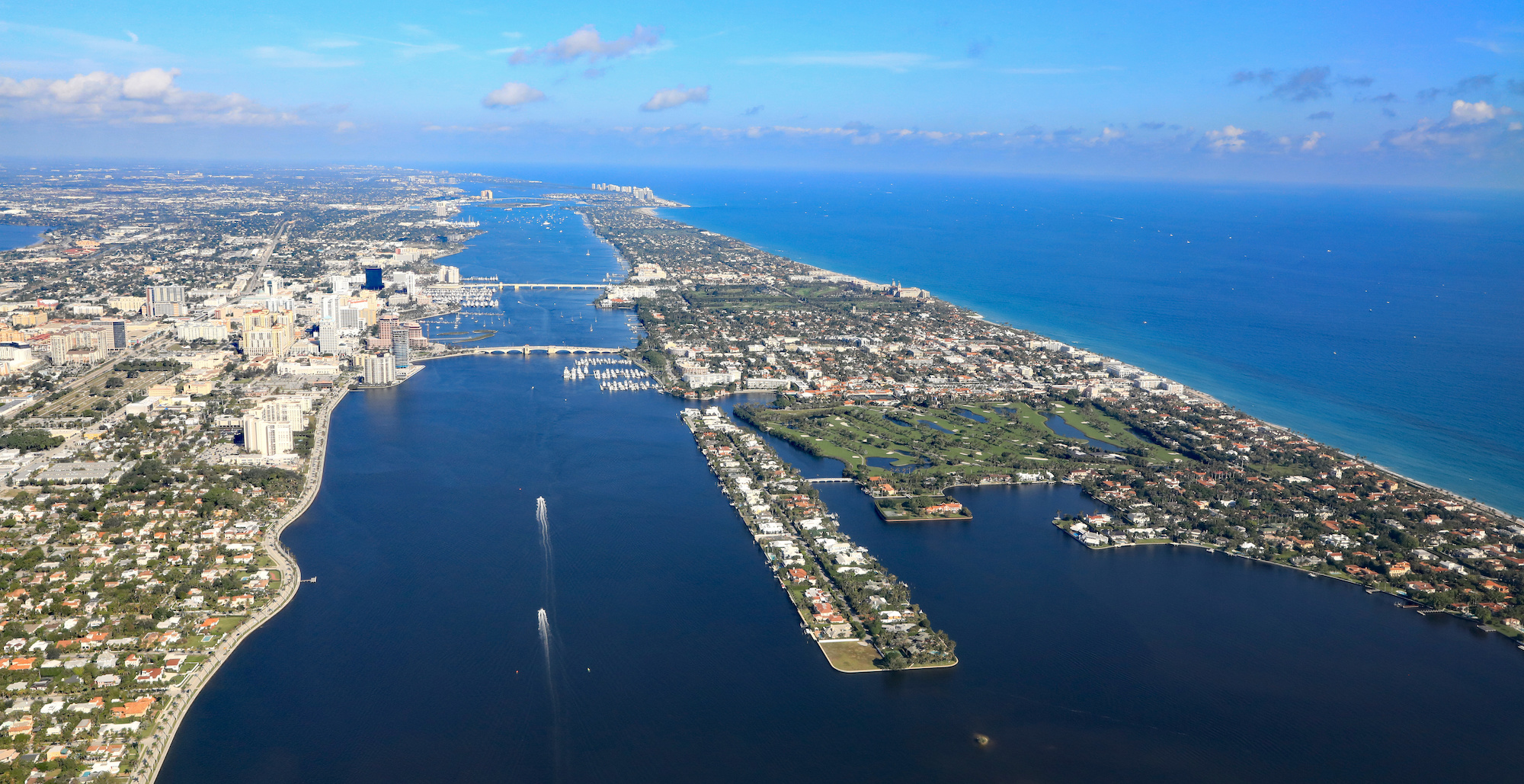 Aerial view of downtown West Palm Beach, Florida, with the Lake Worth Lagoon, and Palm Beach, in South Florida.